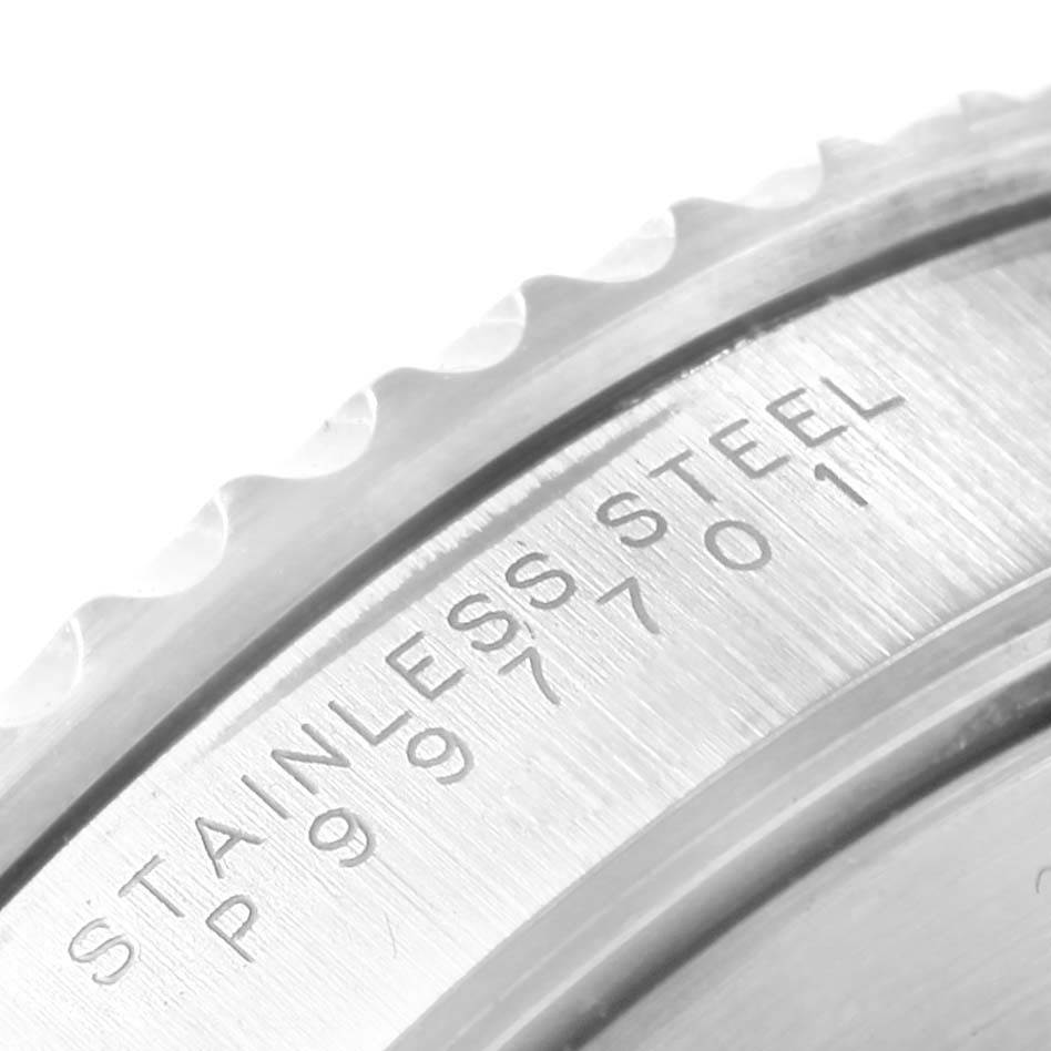 The image shows a close-up of the edge and case back of a Rolex Submariner 14060 Men's Stainless Steel Black Dial 14060 Men's Stainless Steel Black Dial watch, featuring stainless steel engraving and the serial number.