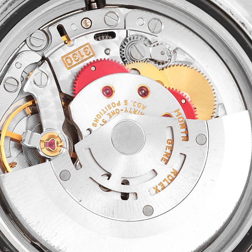 The image shows a close-up of the movement and internal mechanisms of the Rolex Submariner 14060 Men's Stainless Steel Black Dial 14060 Men's Stainless Steel Black Dial watch.
