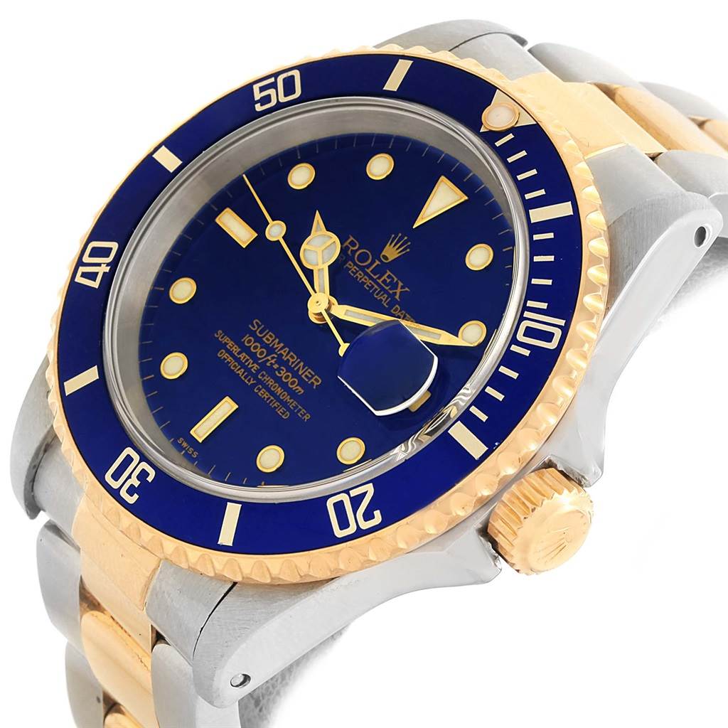 This Rolex Submariner 16613 Men's Steel and Gold (two tone) Blue Dial 16613 Men's Steel and Gold (two tone) Blue Dial is shown from a slightly angled top-down view, highlighting the watch face, bezel, and part of the bracelet.
