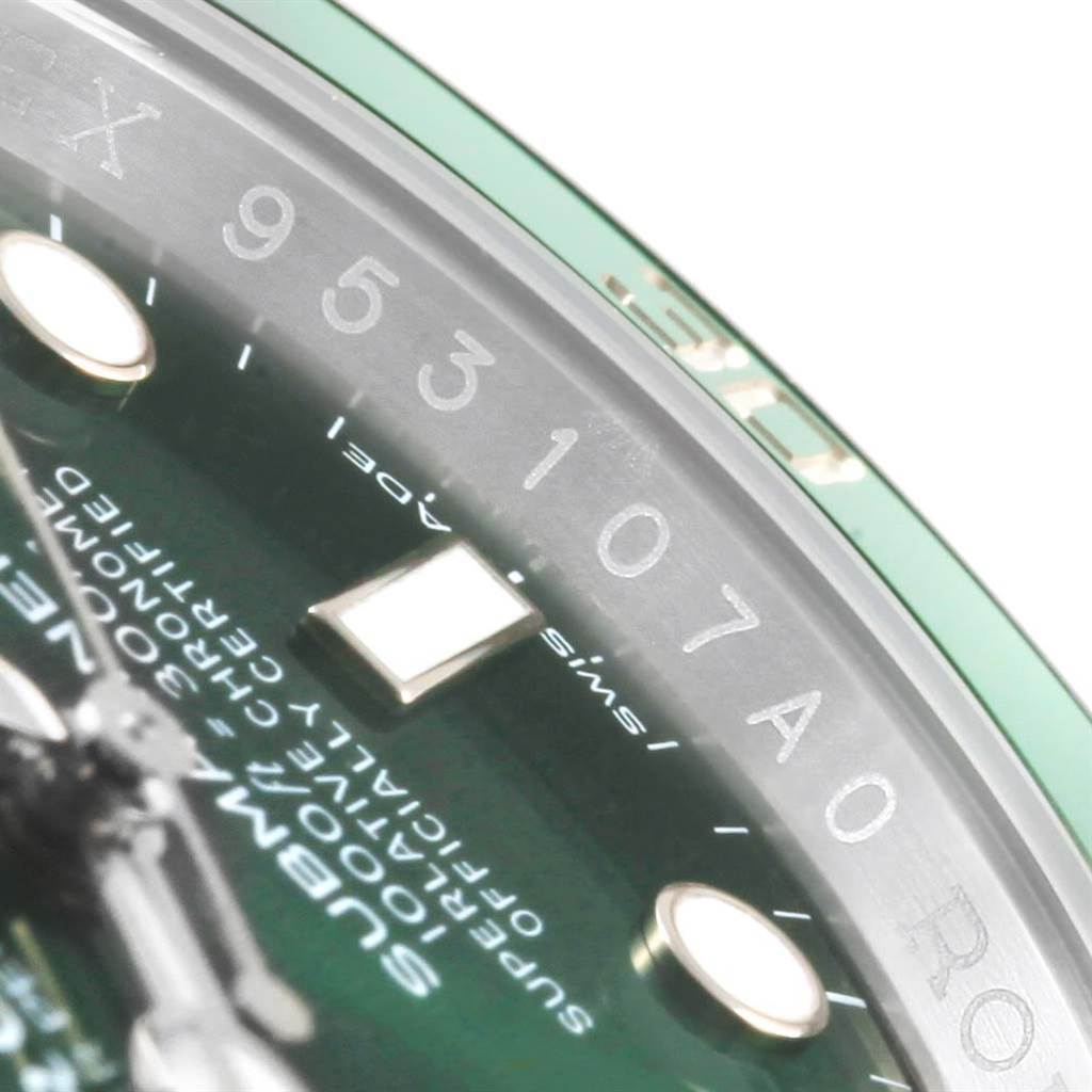 This close-up view of a Rolex Submariner 116610LV Men
s Stainless Steel Green Dial 116610LV Men
s Stainless Steel Green Dial watch shows parts of the dial, indices, and serial number.