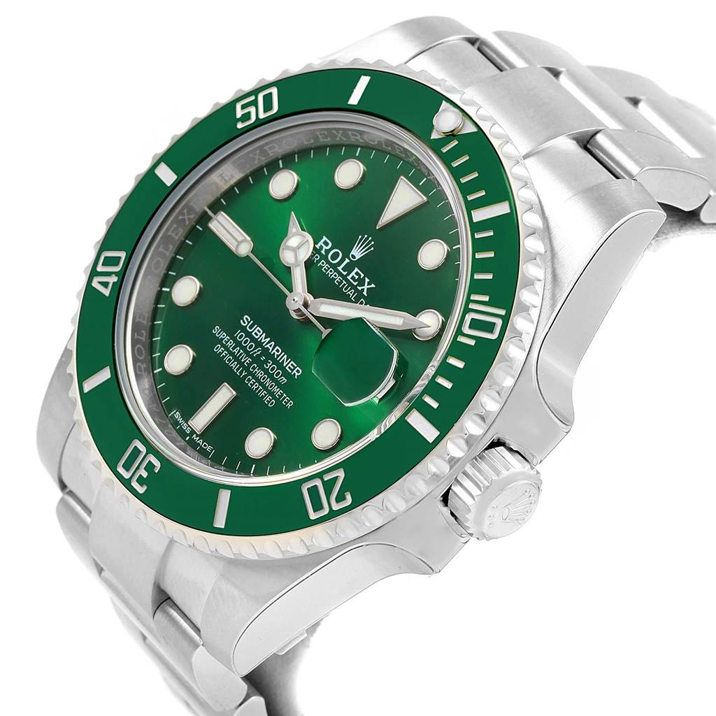 The image shows a Rolex Submariner 116610LV Men
s Stainless Steel Green Dial 116610LV Men
s Stainless Steel Green Dial watch at an oblique angle, highlighting its green bezel, crown, and part of the stainless steel bracelet.