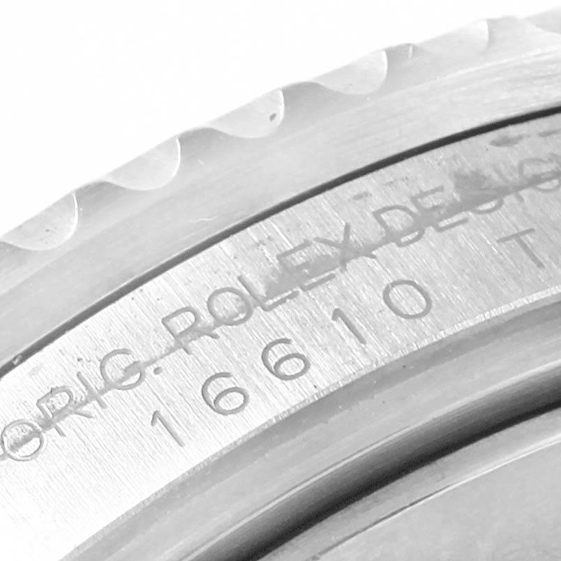 The image shows a close-up of the bezel and case engraving of a Rolex Submariner 16610LV Men's Stainless Steel Black Dial 16610LV Men's Stainless Steel Black Dial 16610 model.