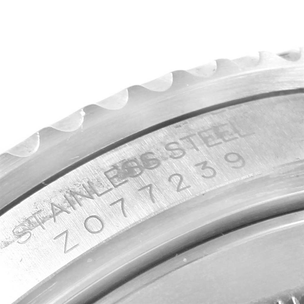 This image shows a close-up of the case back and bezel edge of a stainless steel Rolex Submariner 16610LV Men's Stainless Steel Black Dial 16610LV Men's Stainless Steel Black Dial watch.