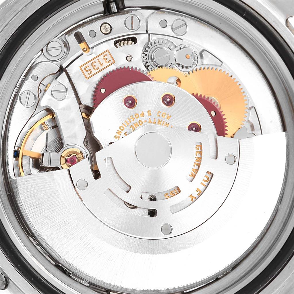 The image shows a close-up view of the movement's inner mechanism of a Rolex Submariner 16610LV Men's Stainless Steel Black Dial 16610LV Men's Stainless Steel Black Dial watch, highlighting gears and intricate parts.