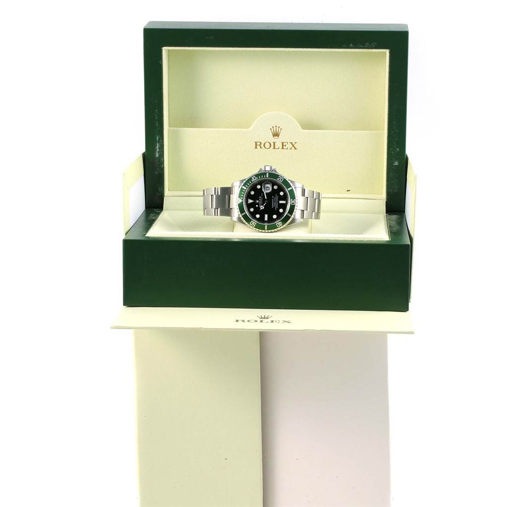 The Rolex Submariner 16610LV Men's Stainless Steel Black Dial 16610LV Men's Stainless Steel Black Dial watch is shown at a front angle inside its green and cream box with the brand logo visible.