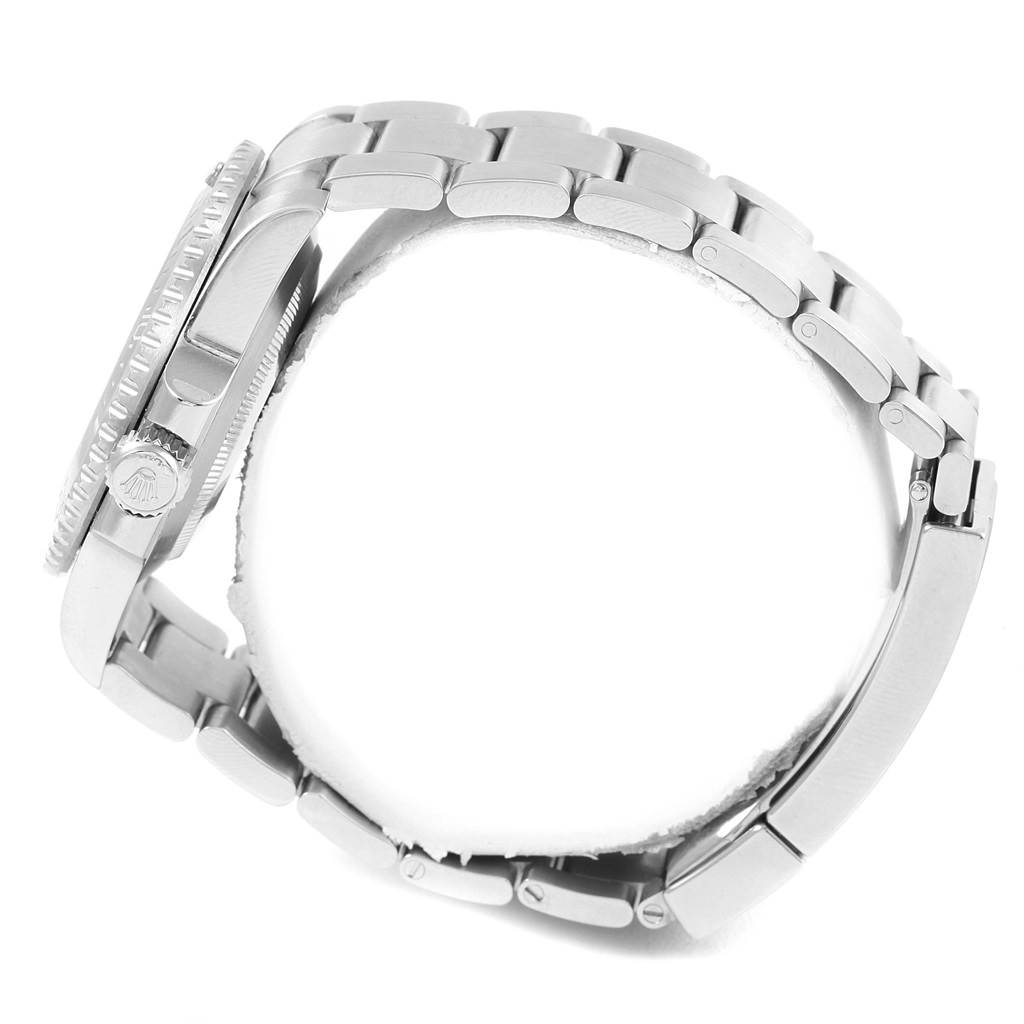 The image shows a side view of a Rolex Submariner 114060 Men's Stainless Steel Black Dial 114060 Men's Stainless Steel Black Dial watch, highlighting its crown, bezel, and metallic bracelet.