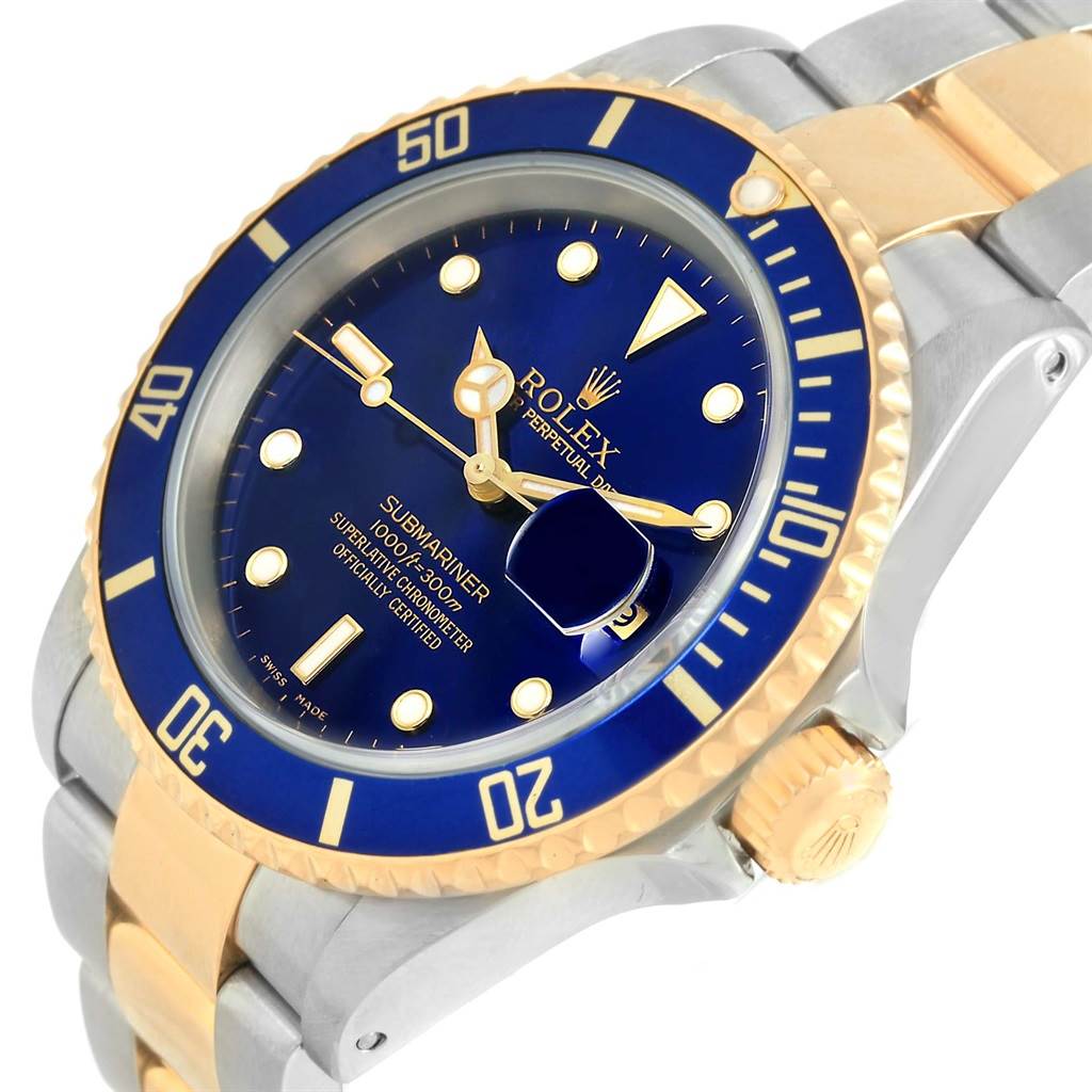 This image shows the Rolex Submariner 16613 Men's Steel and Gold (two tone) Blue Dial 16613 Men's Steel and Gold (two tone) Blue Dial watch at a three-quarter angle, highlighting its blue dial, bezel, and two-tone (gold and stainless steel) bracelet.