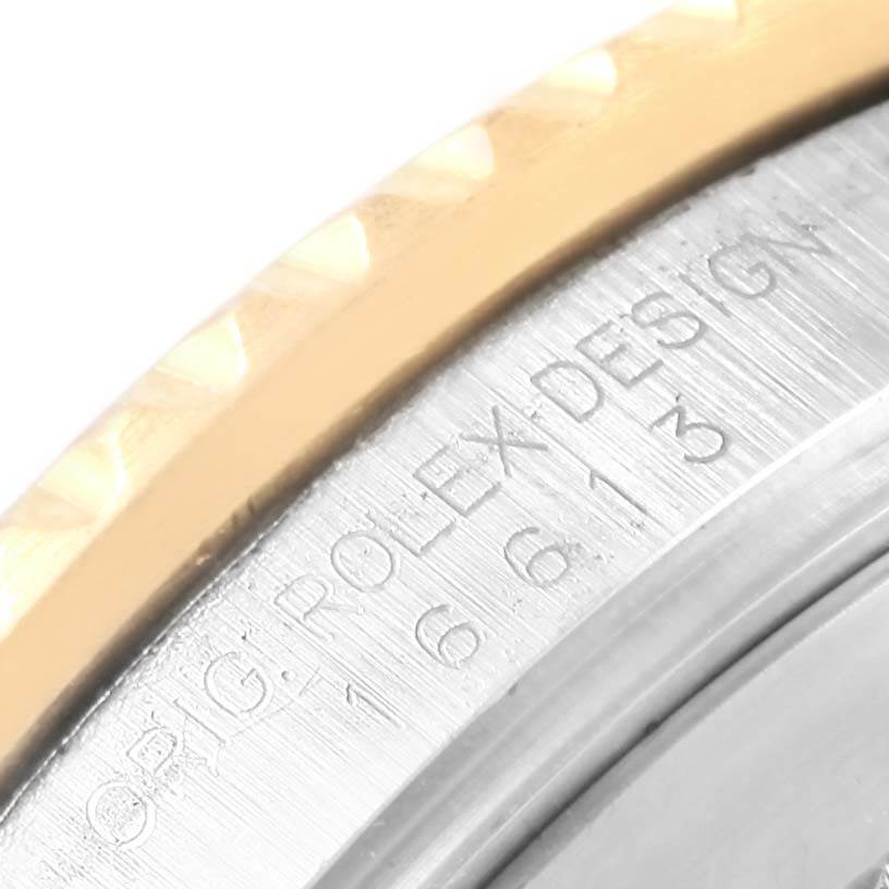 This image shows a close-up of the engraving on the case back of a Rolex Submariner 16613 Men's Steel and Gold (two tone) Blue Dial 16613 Men's Steel and Gold (two tone) Blue Dial watch.