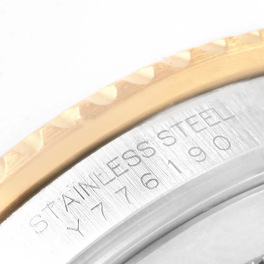This close-up image shows the bezel and the engraved edge of the Rolex Submariner 16613 Men's Steel and Gold (two tone) Blue Dial 16613 Men's Steel and Gold (two tone) Blue Dial watch, emphasizing "Stainless Steel" and part of the reference number.