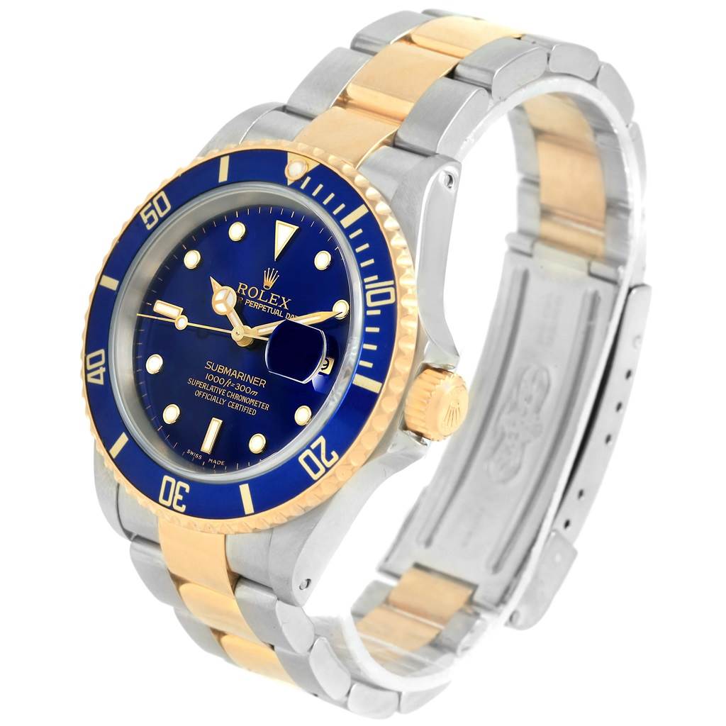 The image shows a Rolex Submariner 16613 Men's Steel and Gold (two tone) Blue Dial 16613 Men's Steel and Gold (two tone) Blue Dial watch at an angle highlighting the face, bezel, crown, and two-tone metal bracelet.