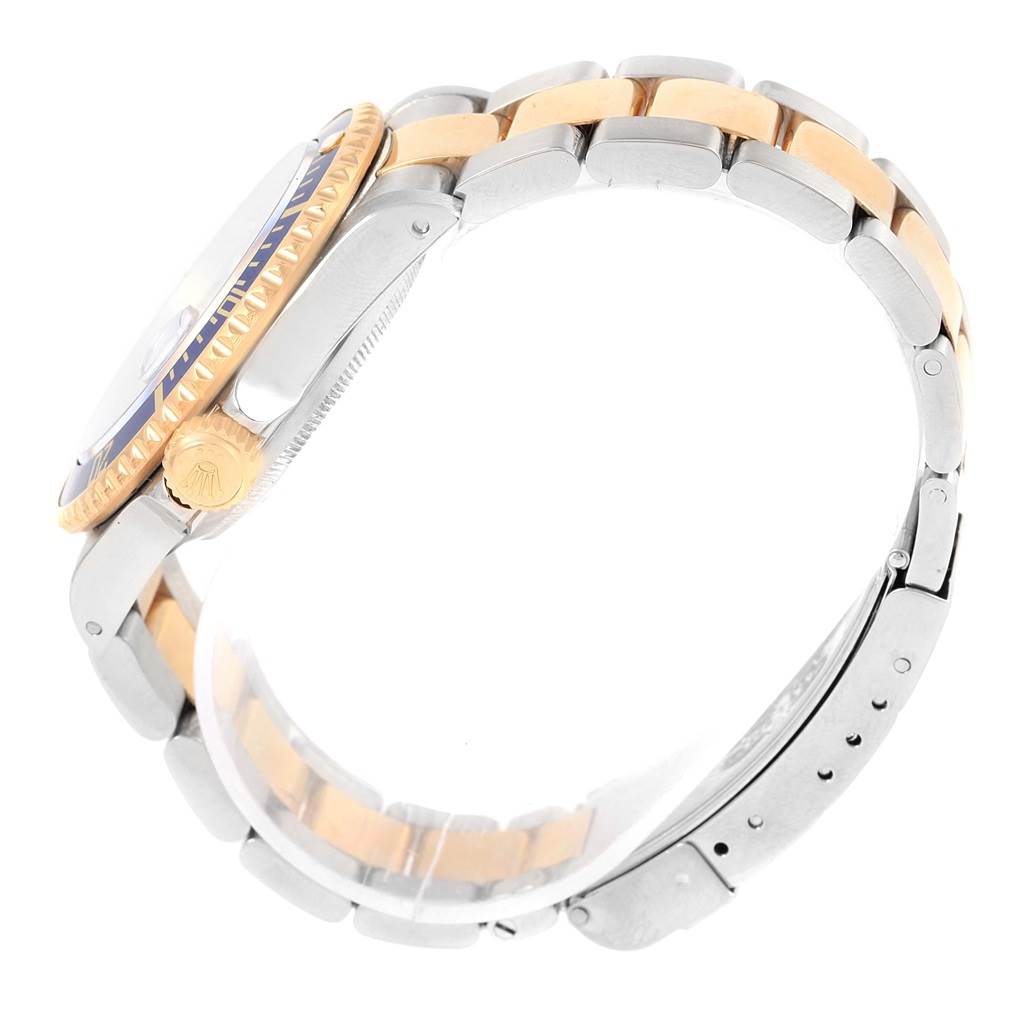 This image shows a side view of the Rolex Submariner 16613 Men's Steel and Gold (two tone) Blue Dial 16613 Men's Steel and Gold (two tone) Blue Dial, highlighting its two-tone bracelet, bezel, and crown.