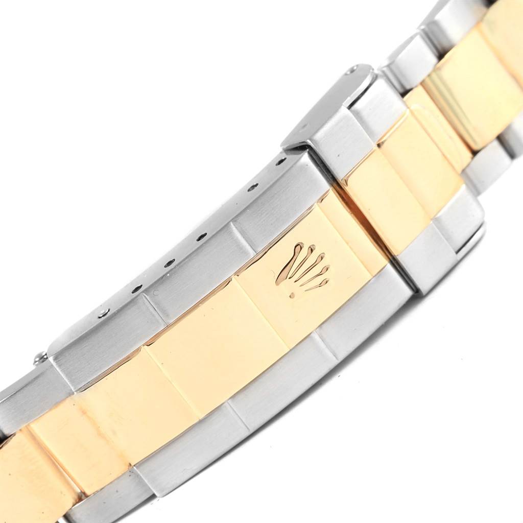 This image shows a close-up angle of the bracelet and clasp of a Rolex Submariner 16613 Men's Steel and Gold (two tone) Blue Dial 16613 Men's Steel and Gold (two tone) Blue Dial watch.