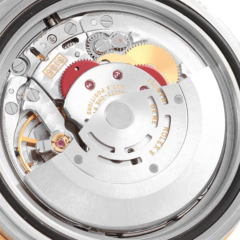 This image shows a close-up view of the movement and internal mechanism of a Rolex Submariner 16613 Men's Steel and Gold (two tone) Blue Dial 16613 Men's Steel and Gold (two tone) Blue Dial watch.