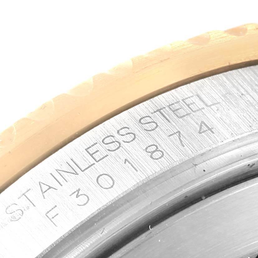 The close-up image shows the engraved stainless steel case back of a Rolex Submariner 16613 Men's Steel and Gold (two tone) Blue Dial 16613 Men's Steel and Gold (two tone) Blue Dial watch.