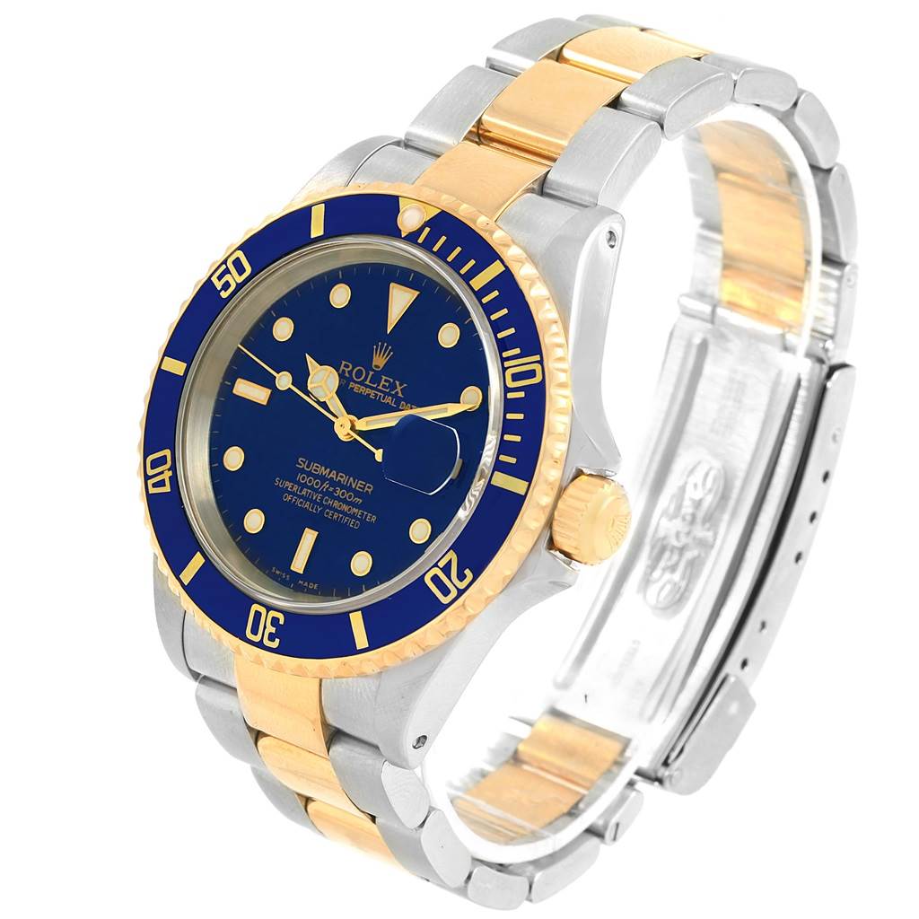This image shows a three-quarter right angle view of a Rolex Submariner 16613 Men's Steel and Gold (two tone) Blue Dial 16613 Men's Steel and Gold (two tone) Blue Dial watch, highlighting its blue and gold bezel, dial, and two-tone bracelet.