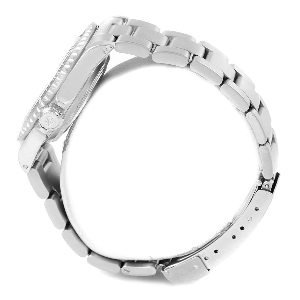 This is a side view of the Rolex Submariner 14060 Men's Stainless Steel Black Dial 14060 Men's Stainless Steel Black Dial, showing its bracelet, case, bezel, and crown.