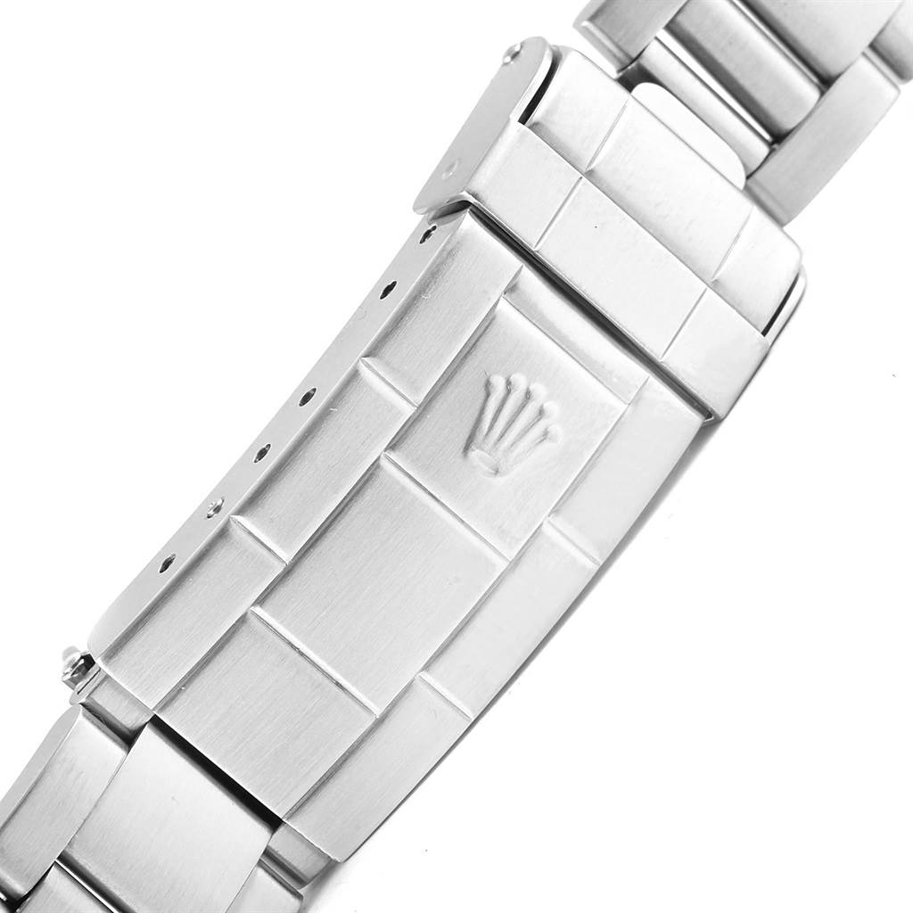 This image shows a detailed view of the clasp and part of the bracelet of a Rolex Submariner 14060 Men's Stainless Steel Black Dial 14060 Men's Stainless Steel Black Dial watch.