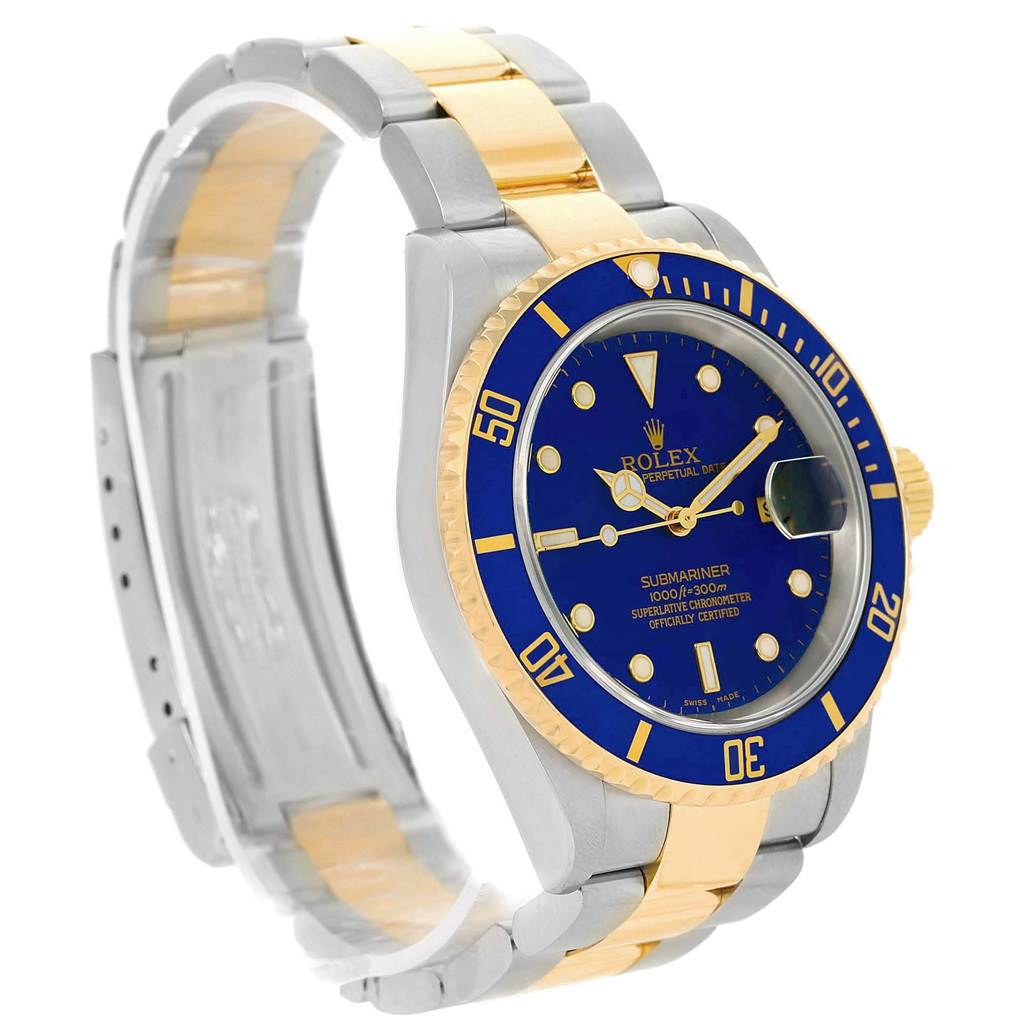 The image shows a side angle of the Rolex Submariner 16613 Men's Steel and Gold (two tone) Blue Dial 16613 Men's Steel and Gold (two tone) Blue Dial watch, highlighting its blue dial, bezel, and a two-tone band.