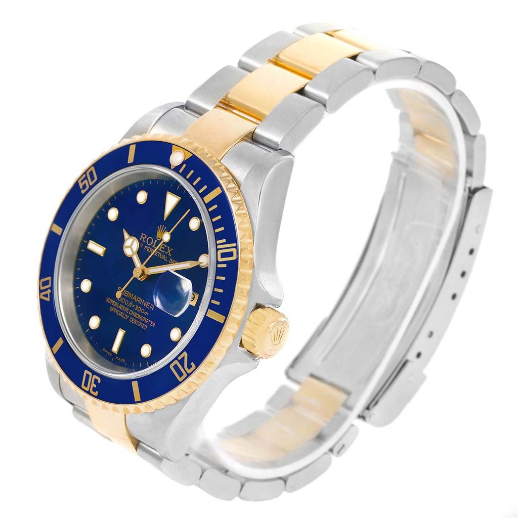 The Rolex Submariner 16613 Men's Steel and Gold (two tone) Blue Dial 16613 Men's Steel and Gold (two tone) Blue Dial watch is displayed at a three-quarter angle, showing its blue dial, bezel, and two-tone metal bracelet.
