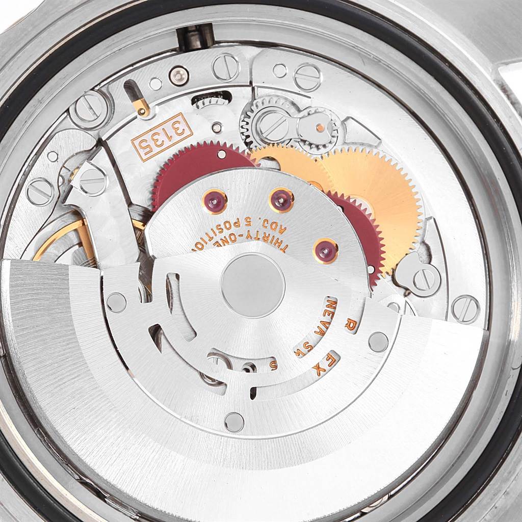 This photo shows the internal mechanism of a Rolex Submariner 16613 Men's Steel and Gold (two tone) Blue Dial 16613 Men's Steel and Gold (two tone) Blue Dial watch, highlighting gears and the rotor.