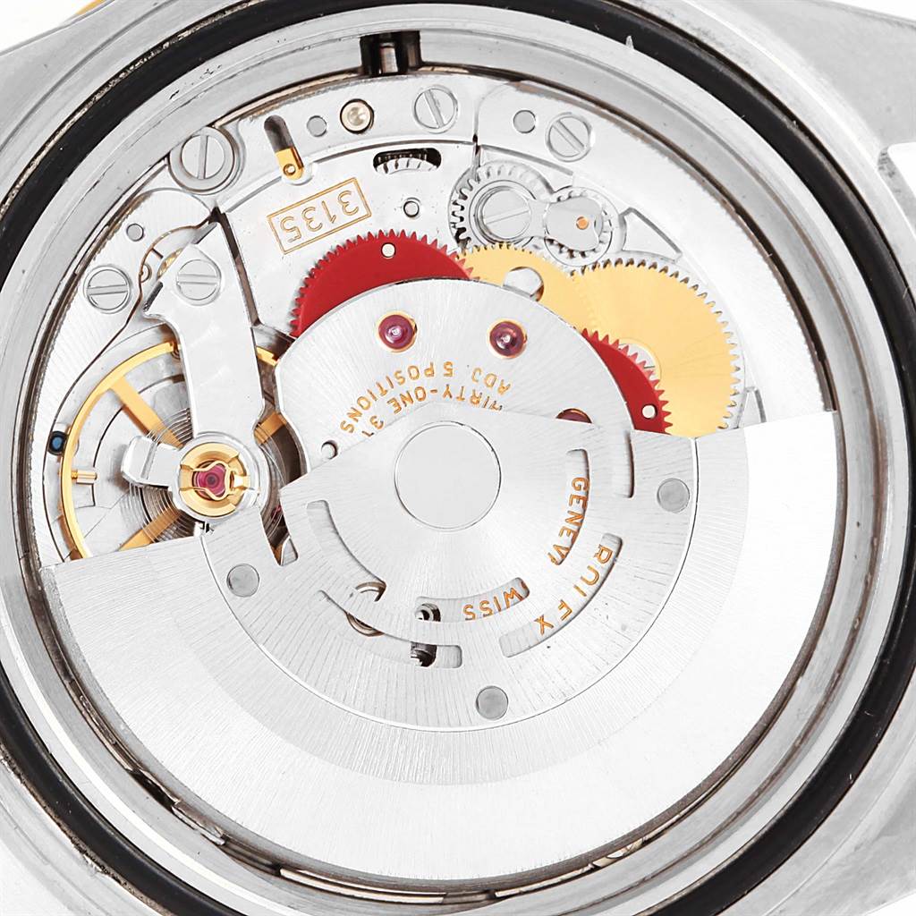 This image shows the movement and internal mechanism of a Rolex Submariner 16613 Men's Steel and Gold (two tone) Black Dial 16613 Men's Steel and Gold (two tone) Black Dial watch from a back angle.