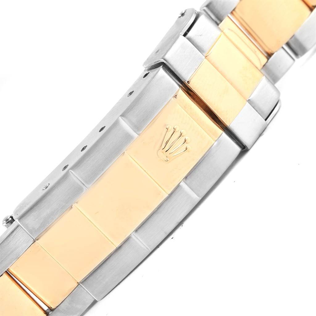 This image shows a close-up view of the clasp and part of the bracelet of a Rolex Submariner 16613 Men's Steel and Gold (two tone) Grey Dial 16613 Men's Steel and Gold (two tone) Grey Dial watch.