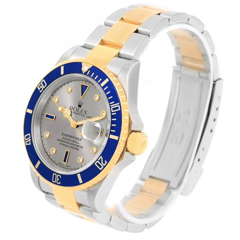 The image shows a Rolex Submariner 16613 Men's Steel and Gold (two tone) Grey Dial 16613 Men's Steel and Gold (two tone) Grey Dial watch at a side angle, highlighting the dial, bezel, crown, and bracelet.