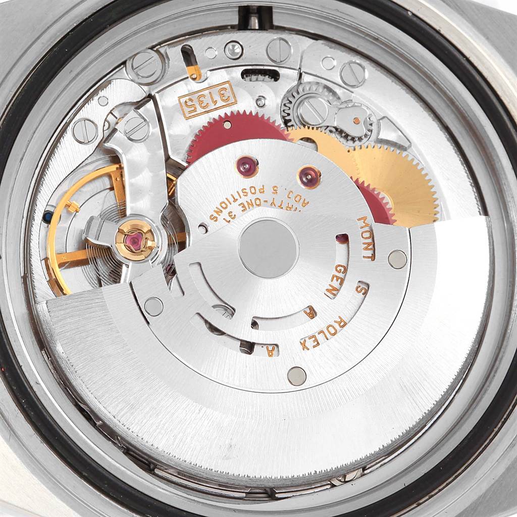 The image shows a close-up view of the Rolex Submariner 16613 Men's Steel and Gold (two tone) Grey Dial 16613 Men's Steel and Gold (two tone) Grey Dial's movement, displaying intricate gears and internal components.