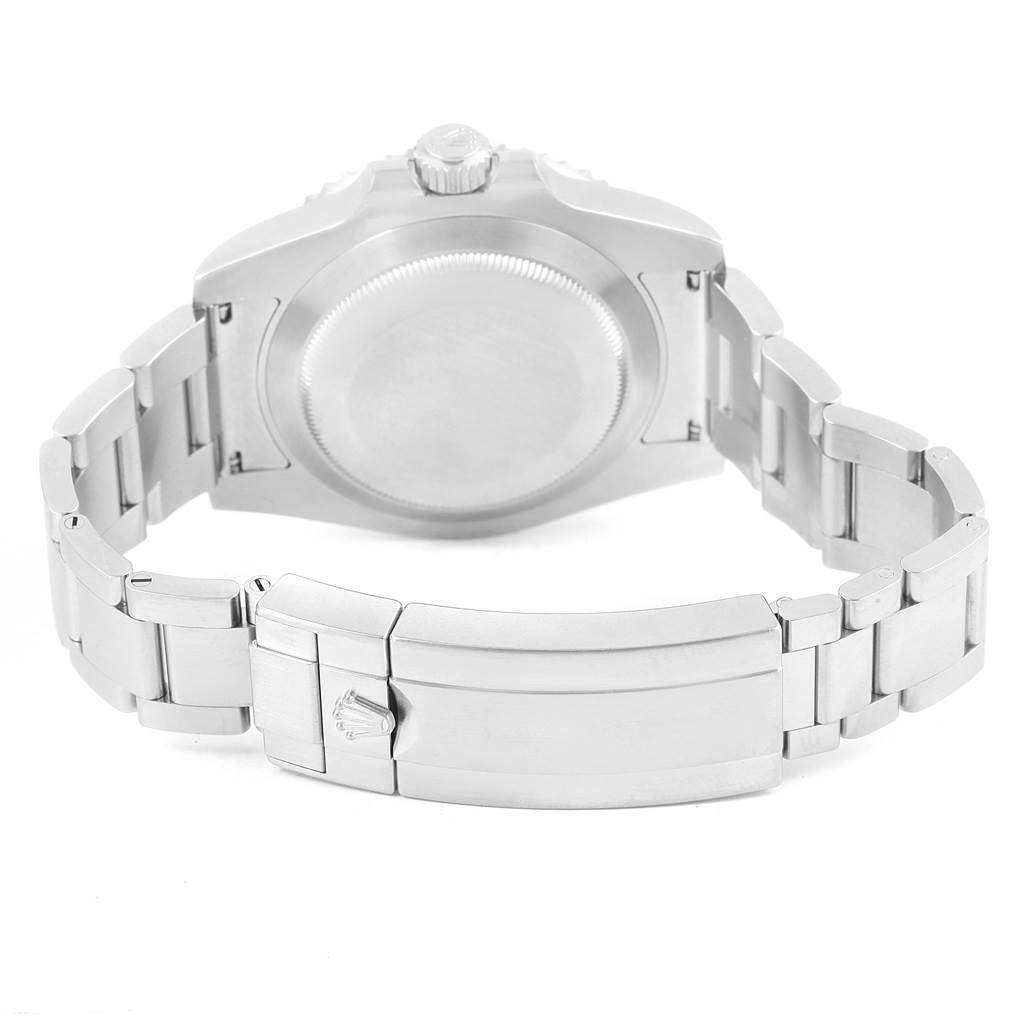 The image shows the back view of a Rolex Submariner 116610LV Men's Stainless Steel Green Dial 116610LV Men's Stainless Steel Green Dial, highlighting its case back and metal bracelet clasp.