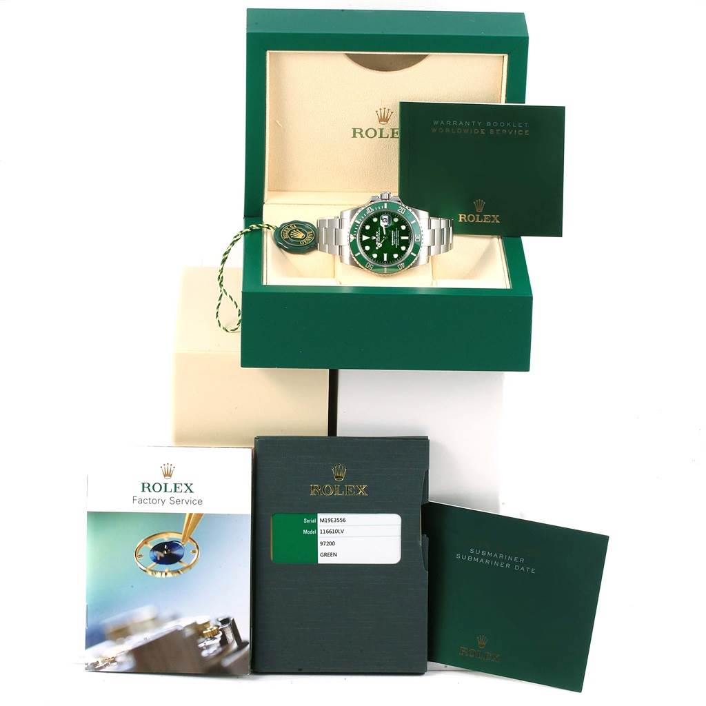The image shows a Rolex Submariner 116610LV Men's Stainless Steel Green Dial 116610LV Men's Stainless Steel Green Dial watch with a green dial in its box alongside warranty booklets and a service booklet.