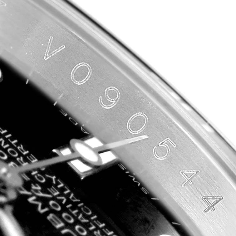 The image shows a close-up angle of the dial and hand of a Rolex Submariner 16610LV Men's Stainless Steel Black Dial 16610LV Men's Stainless Steel Black Dial, highlighting part of the serial and model number.