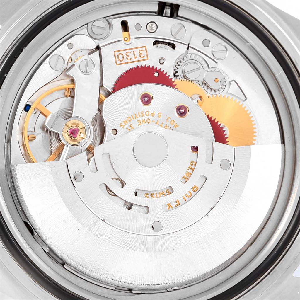 This image shows the internal mechanism of a Rolex Submariner 14060 Men's Stainless Steel Black Dial 14060 Men's Stainless Steel Black Dial watch, highlighting its gears and intricate components from a top-down angle.