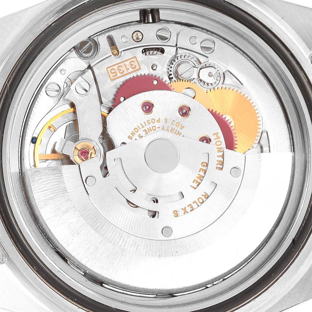 This image shows the internal mechanics of a Rolex Submariner 16610 Men's Stainless Steel Black Dial 16610 Men's Stainless Steel Black Dial watch, specifically the movement module from a top-down view.