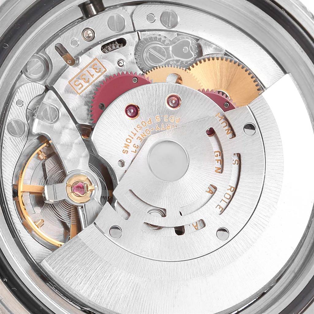 This image shows a close-up view of the movement inside a Rolex Submariner 16613 Men's Steel and Gold (two tone) Black Dial 16613 Men's Steel and Gold (two tone) Black Dial watch, highlighting the intricate gears and mechanisms.