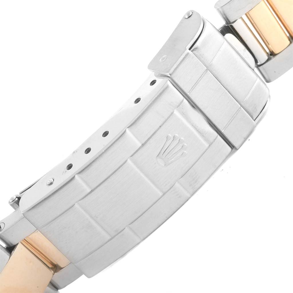 The image shows the clasp of a Rolex Submariner 16613 Men's Steel and Gold (two tone) Blue Dial 16613 Men's Steel and Gold (two tone) Blue Dial watch, featuring the brand's crown logo.