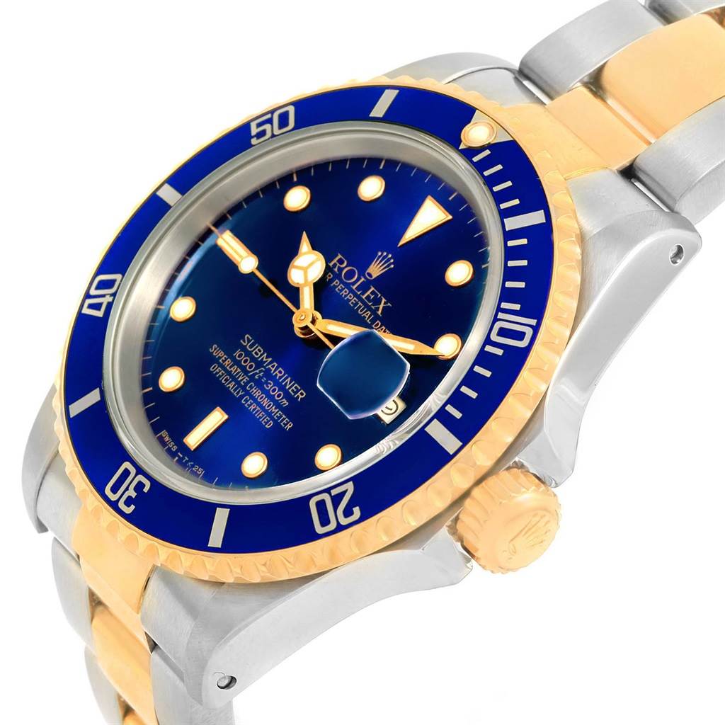 This Rolex Submariner 16613 Men's Steel and Gold (two tone) Blue Dial 16613 Men's Steel and Gold (two tone) Blue Dial watch is shown at an oblique angle, highlighting its blue dial, bezel, and two-tone metal bracelet.