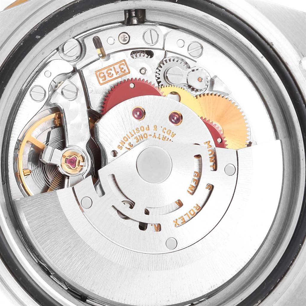 This image shows the internal movement mechanism of a Rolex Submariner 16613 Men's Steel and Gold (two tone) Blue Dial 16613 Men's Steel and Gold (two tone) Blue Dial watch from a back angle.