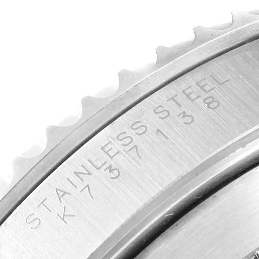 This close-up image shows the edge and engraving of a Rolex Submariner 14060 Men's Stainless Steel Black Dial 14060 Men's Stainless Steel Black Dial watch, featuring the text "STAINLESS STEEL."