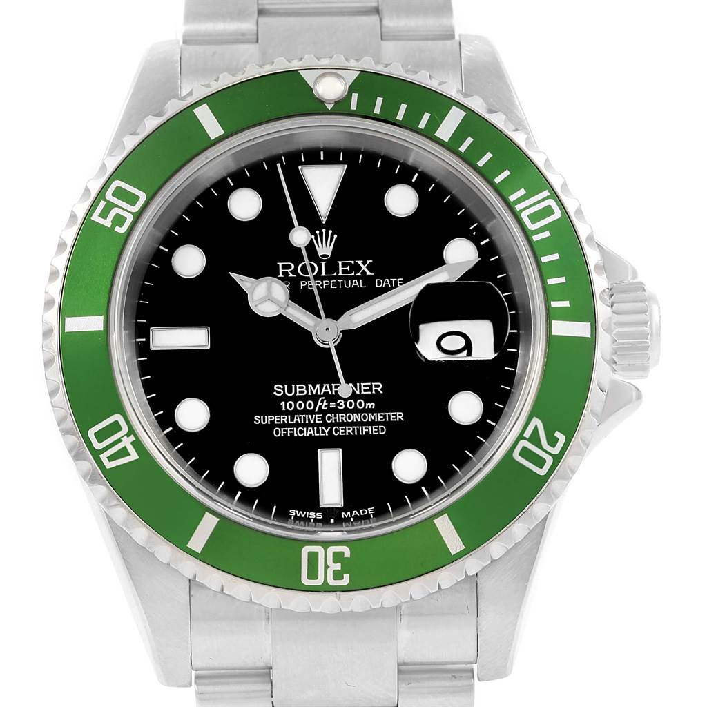 This is a front view of a Rolex Submariner 16610LV Men's Stainless Steel Black Dial 16610LV Men's Stainless Steel Black Dial watch showcasing the dial, green bezel, and part of the stainless steel bracelet.