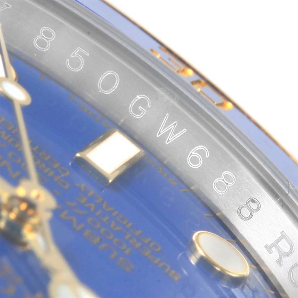 This image shows a close-up of the dial and the inner bezel of a Rolex Submariner 116613 Men's Steel and Gold (two tone) Blue Dial 116613 Men's Steel and Gold (two tone) Blue Dial watch.