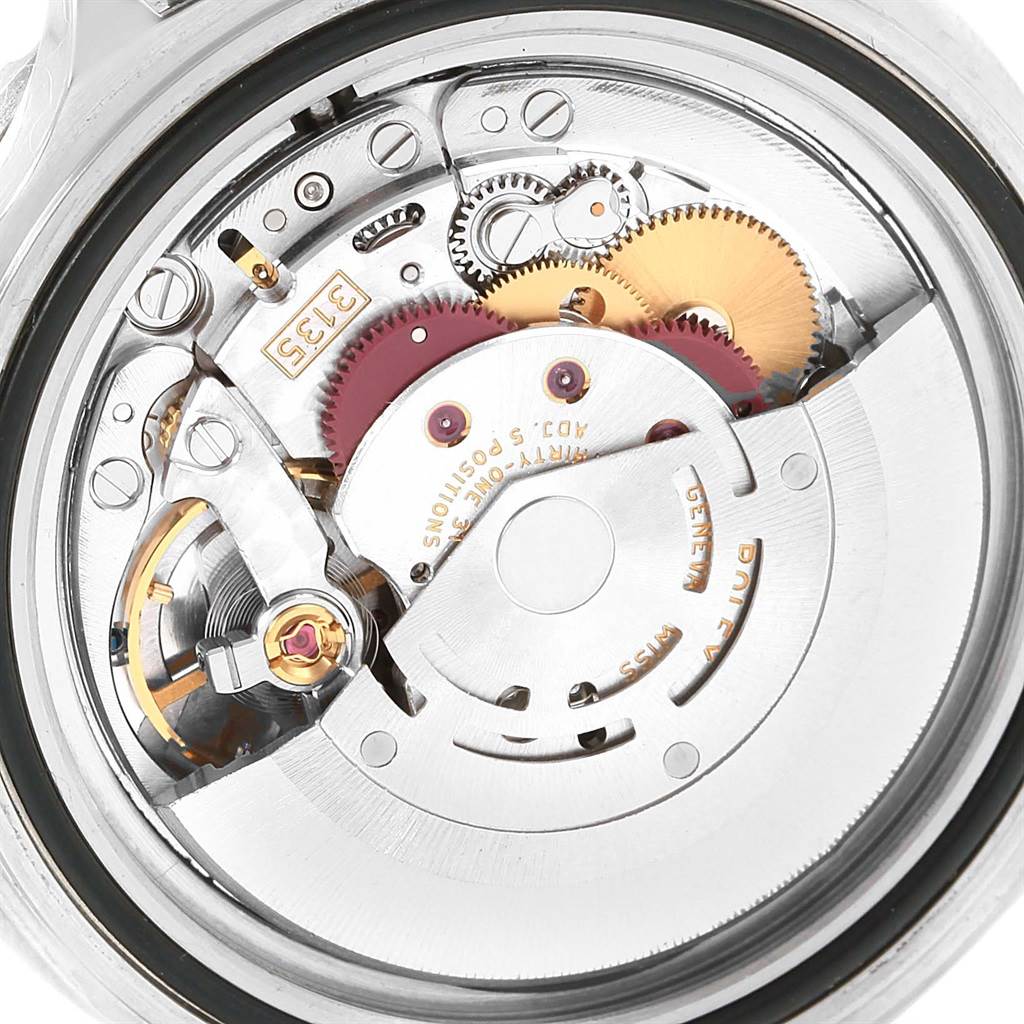 This image shows the intricate internal movement mechanism of a Rolex Submariner 16610LV Men's Stainless Steel Black Dial 16610LV Men's Stainless Steel Black Dial watch with its gears and components.