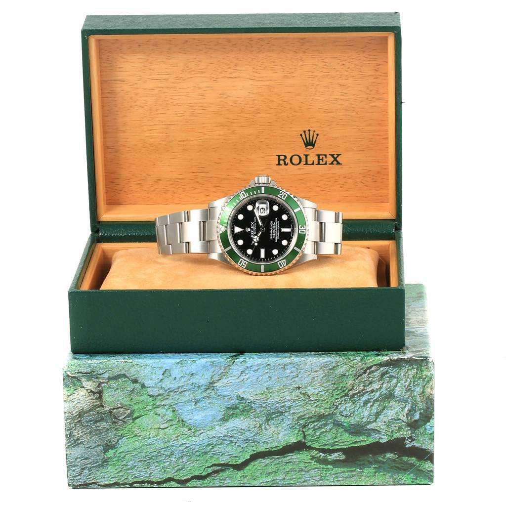 The image shows a Rolex Submariner 16610LV Men's Stainless Steel Black Dial 16610LV Men's Stainless Steel Black Dial watch displayed front-facing in an open Rolex box with a wooden interior.