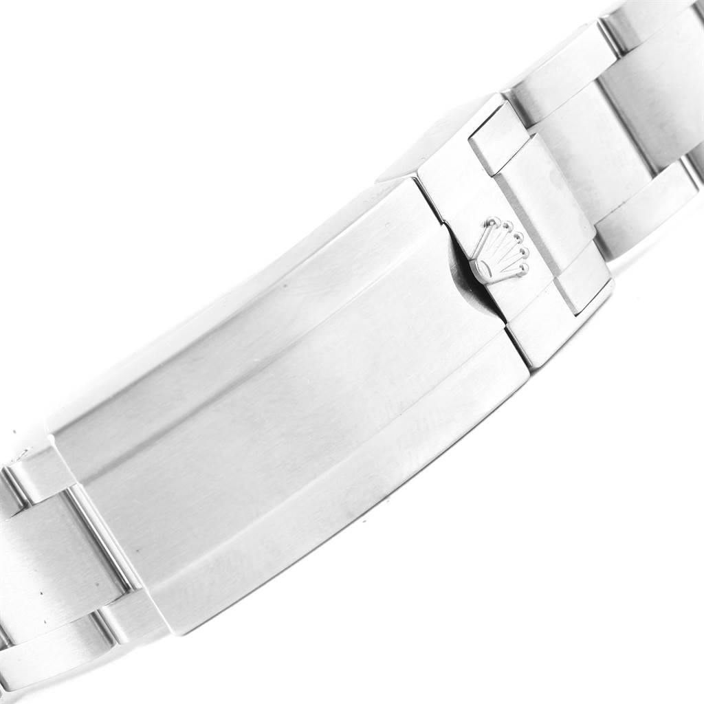 The image shows the clasp and bracelet of a Rolex Submariner 116610LV Men's Stainless Steel Green Dial 116610LV Men's Stainless Steel Green Dial watch from a top-down angle.