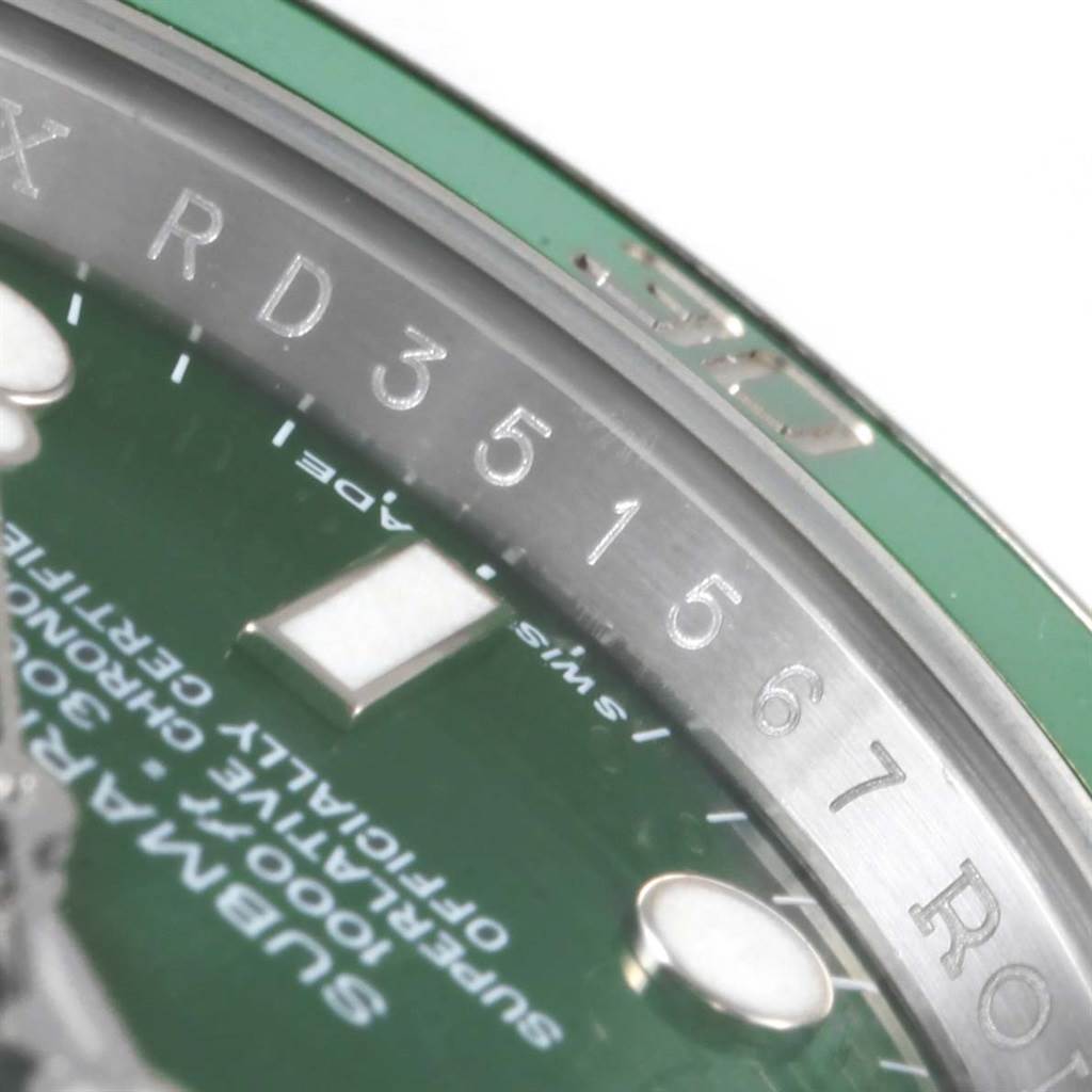The image shows a close-up view of the chapter ring, dial, and part of the bezel of a Rolex Submariner 116610LV Men's Stainless Steel Green Dial 116610LV Men's Stainless Steel Green Dial watch.