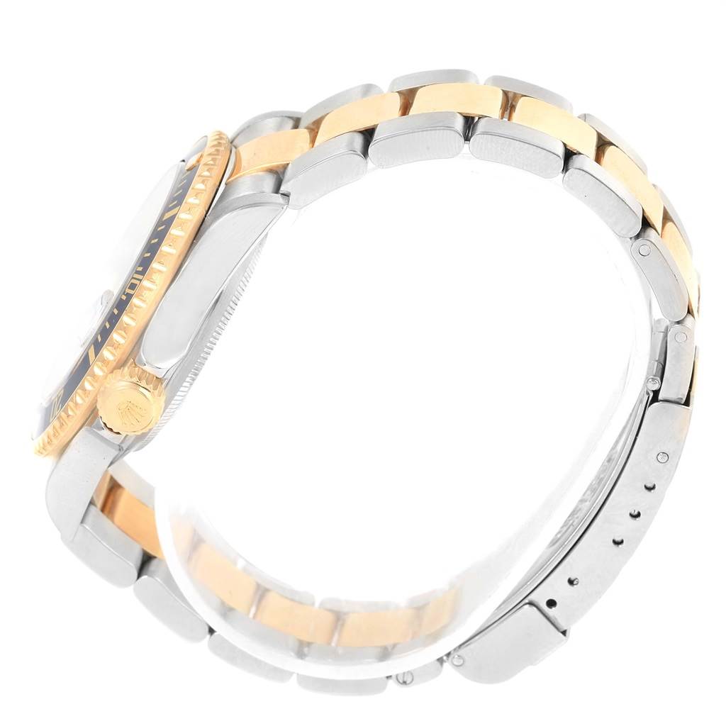 This image shows a side view of a two-tone Rolex Submariner 16613 Men's Steel and Gold (two tone) Blue Dial 16613 Men's Steel and Gold (two tone) Blue Dial, highlighting its case, bezel, crown, and bracelet.