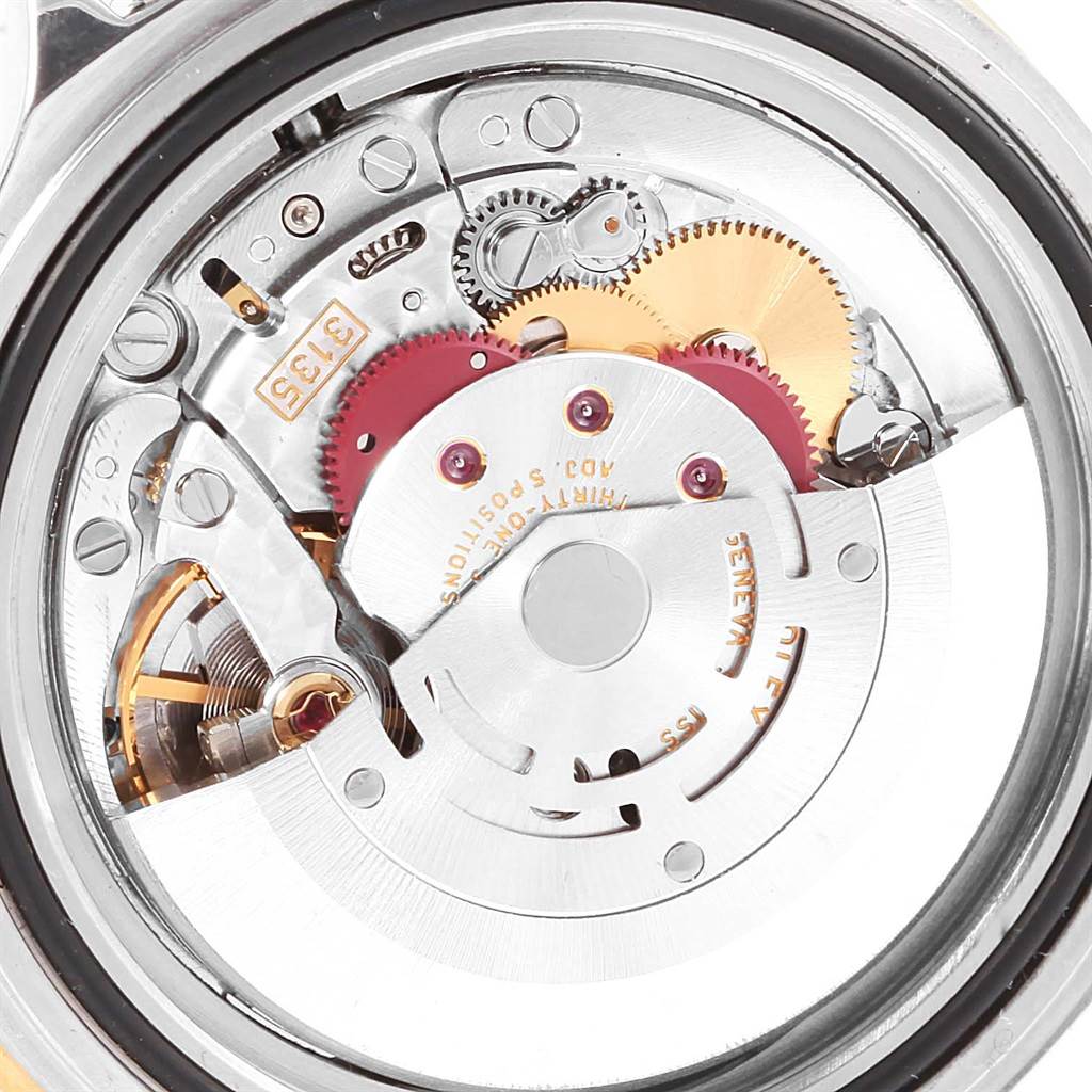 The image shows the intricate internal mechanism of a Rolex Submariner 16613 Men's Steel and Gold (two tone) Blue Dial 16613 Men's Steel and Gold (two tone) Blue Dial watch viewed from the back.