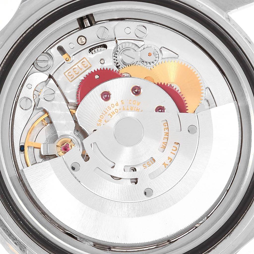 This image shows the internal mechanism and gears of a Rolex Submariner 16610LV Men's Stainless Steel Black Dial 16610LV Men's Stainless Steel Black Dial watch from a back view angle.