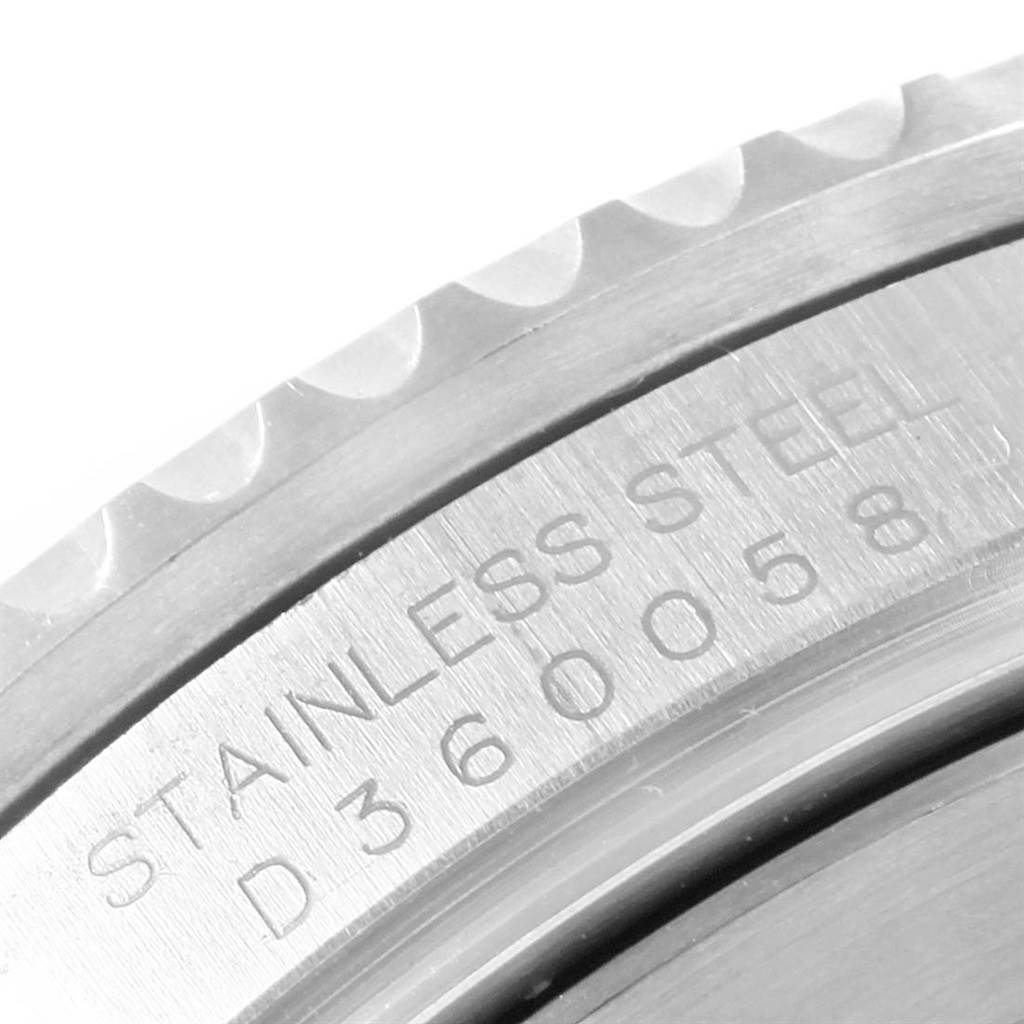 The image shows a close-up of the bezel and engraved stainless steel case back of a Rolex Submariner 16610LV Men's Stainless Steel Black Dial 16610LV Men's Stainless Steel Black Dial watch.