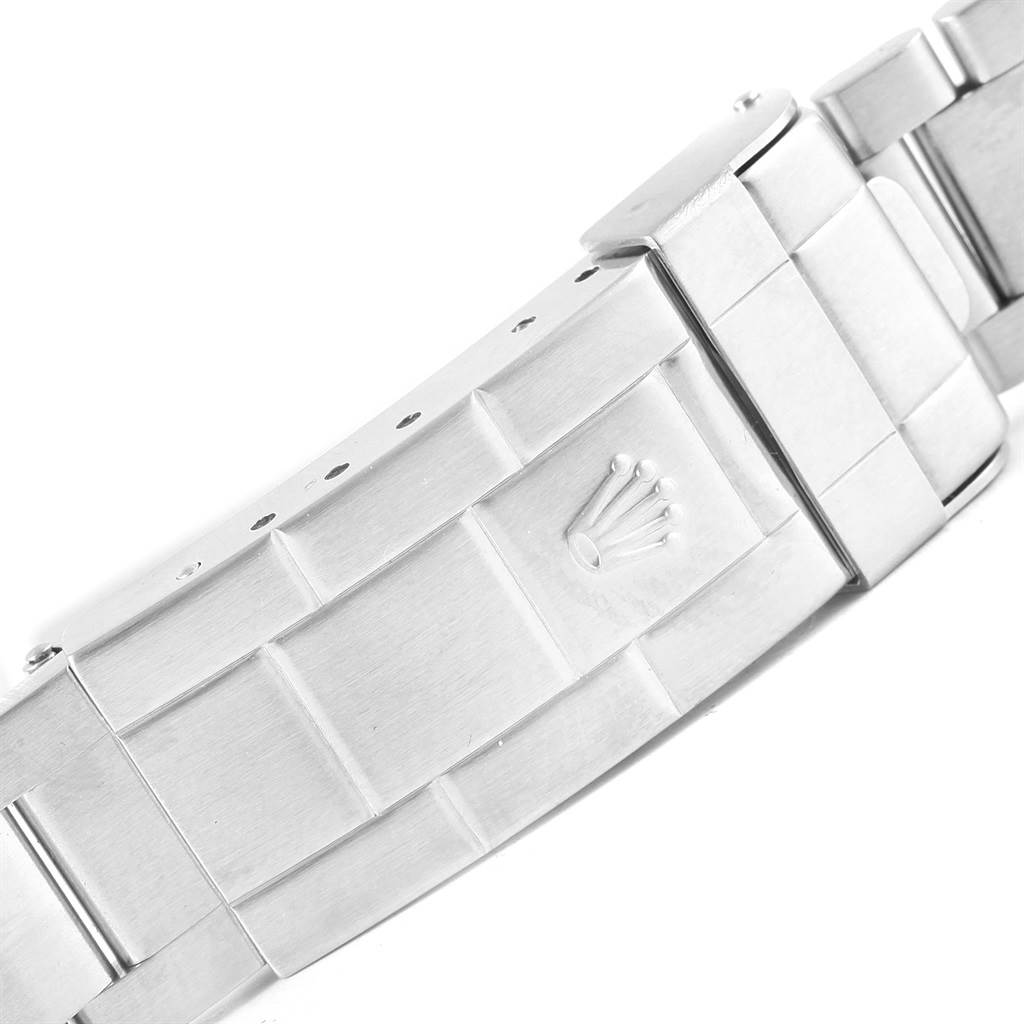 This image shows a close-up of the clasp and part of the metal bracelet of a Rolex Submariner 16610LV Men's Stainless Steel Black Dial 16610LV Men's Stainless Steel Black Dial watch.