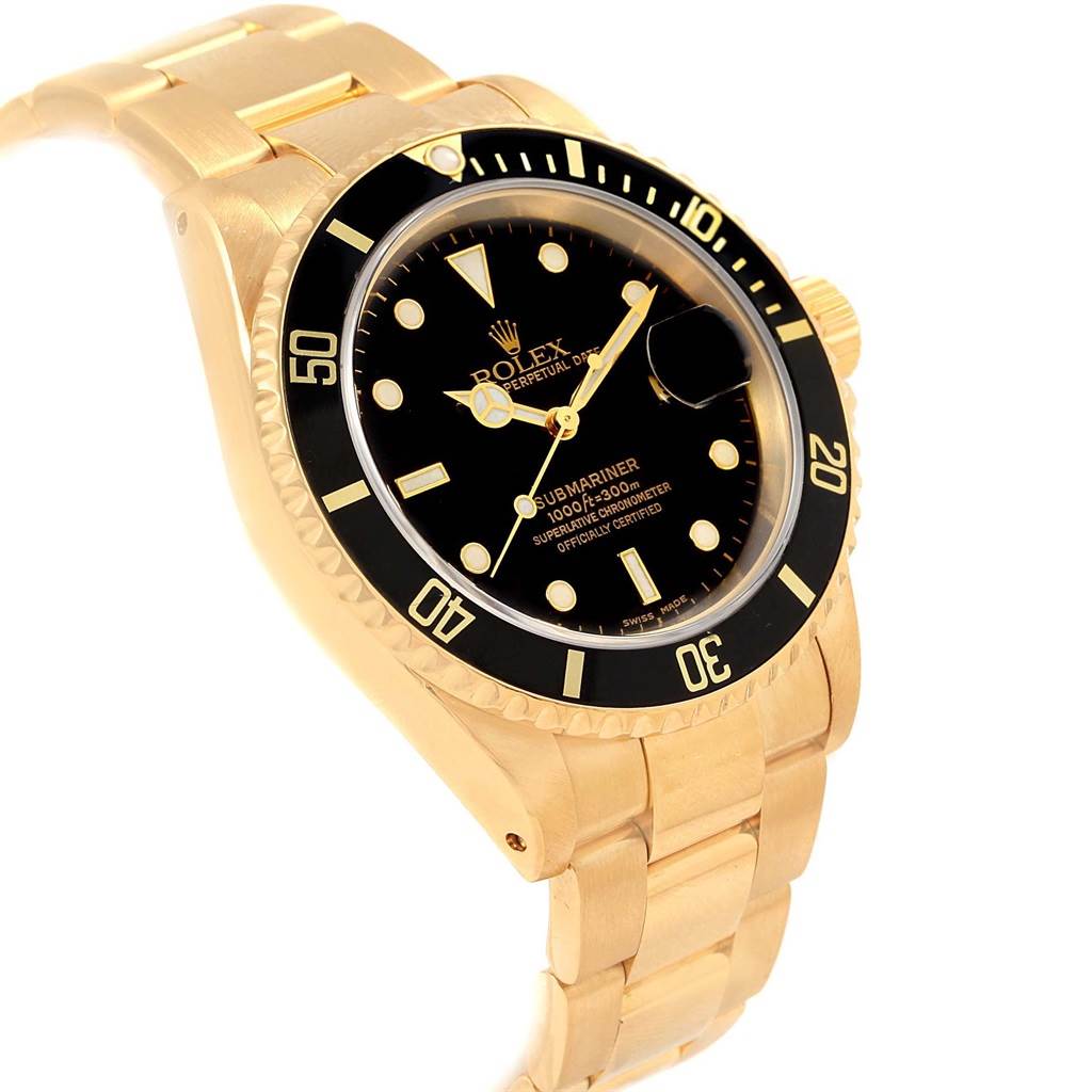 The image shows a Rolex Submariner 16618 Men
s Yellow Gold Black Dial 16618 Men
s Yellow Gold Black Dial watch at a three-quarter angle, highlighting its dial, bezel, and part of its bracelet.